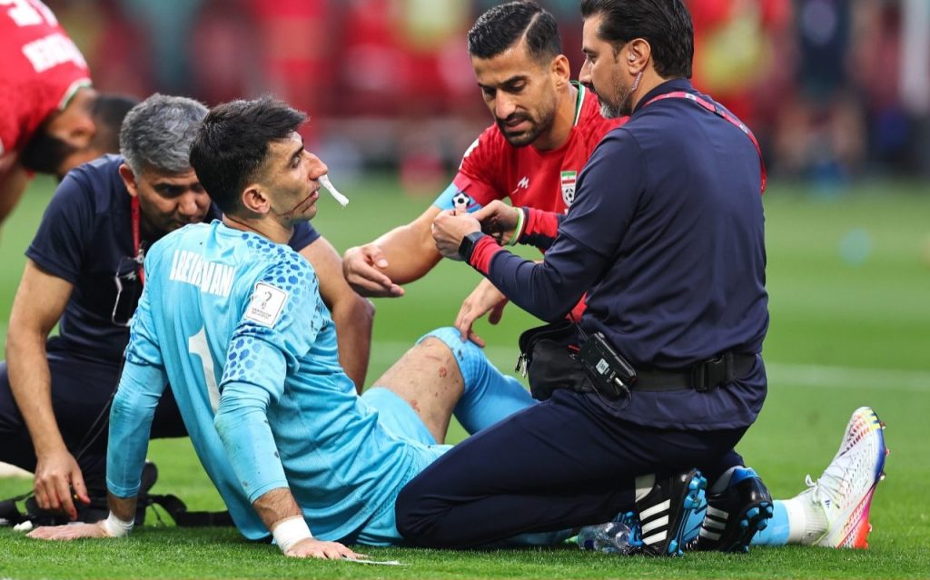 Iran goalkeeper tries to play on in opposition to England after horror head conflict, then collapses Iran goalkeeper tries to play on against England after horror head clash, then collapses