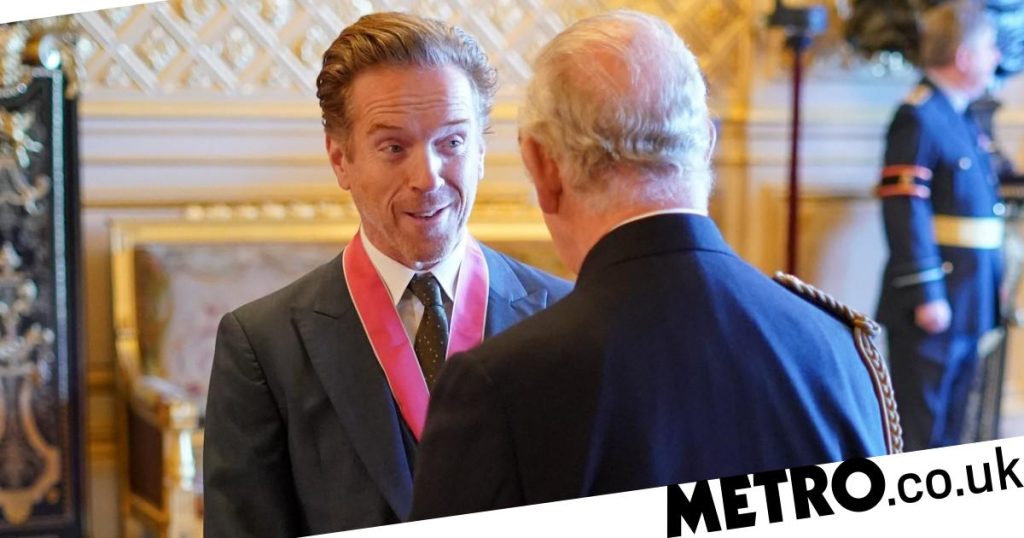 Damian Lewis beams as he receives CBE from King Charles