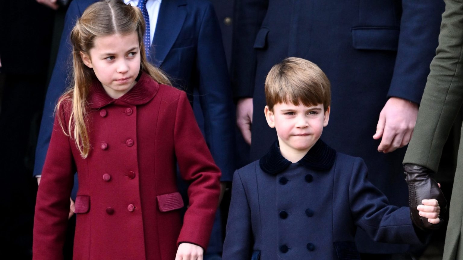 Prince Louis steals the show at Sandringham Christmas walk as delighted crowds shower him with gifts